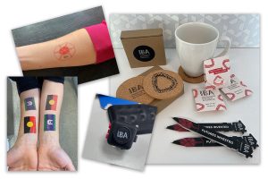 collage of branded items including tattoos, teabags, coaster and pen.